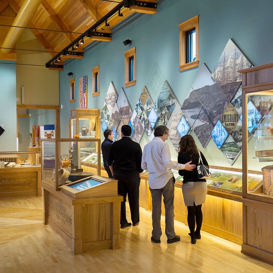 Visitors explore the exhibits of the Livsreise Norwegian Heritage Center; the Goose Crown Inn