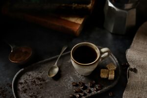 Coffee break origin depicting a coffee cup on a rustic background in Stoughton WI, the Goose Crown Inn