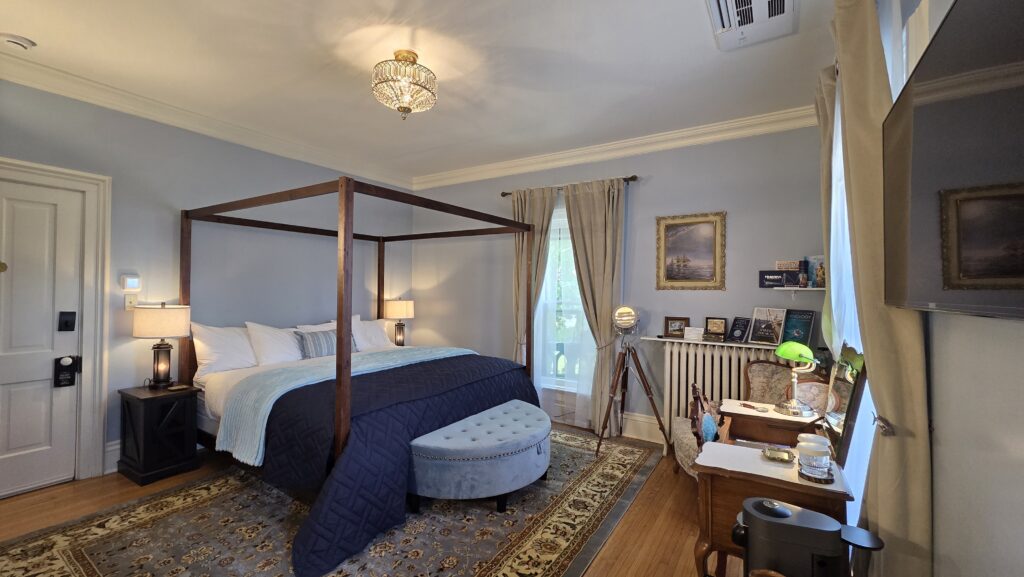 King four-poster bed in nautical themed room at the Goose Crown Inn in Stoughton WI.