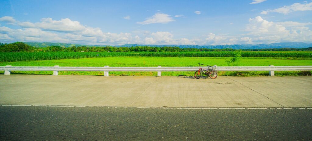 Cycling on Wisconsin landscape: bicycle on green farmland background near Stoughton; the Goose Crown Inn