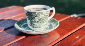 Coffee cup on a table outside for the Stoughton Coffee Break Festival; the Goose Crown Inn