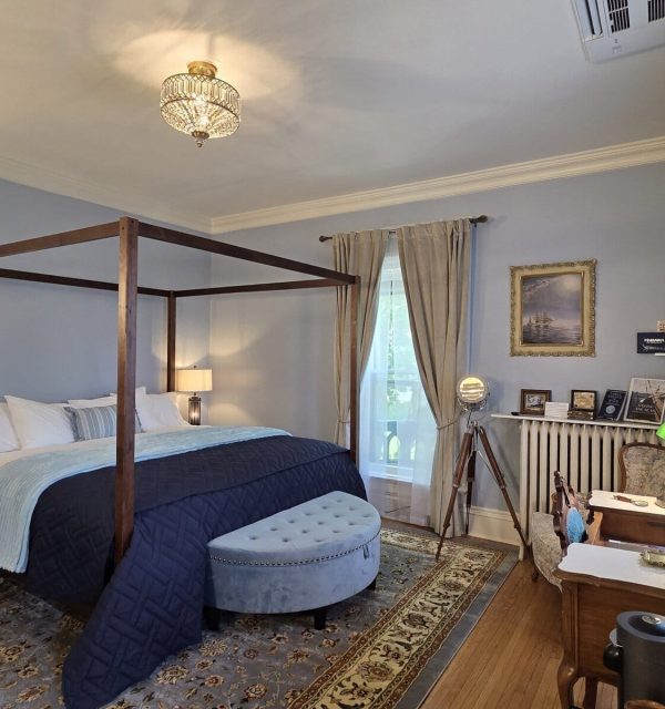 King four-poster bed in nautical themed room at the Goose Crown Inn in Stoughton WI.
